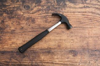 black handle on brown wooden table by iMattSmart courtesy of Unsplash.